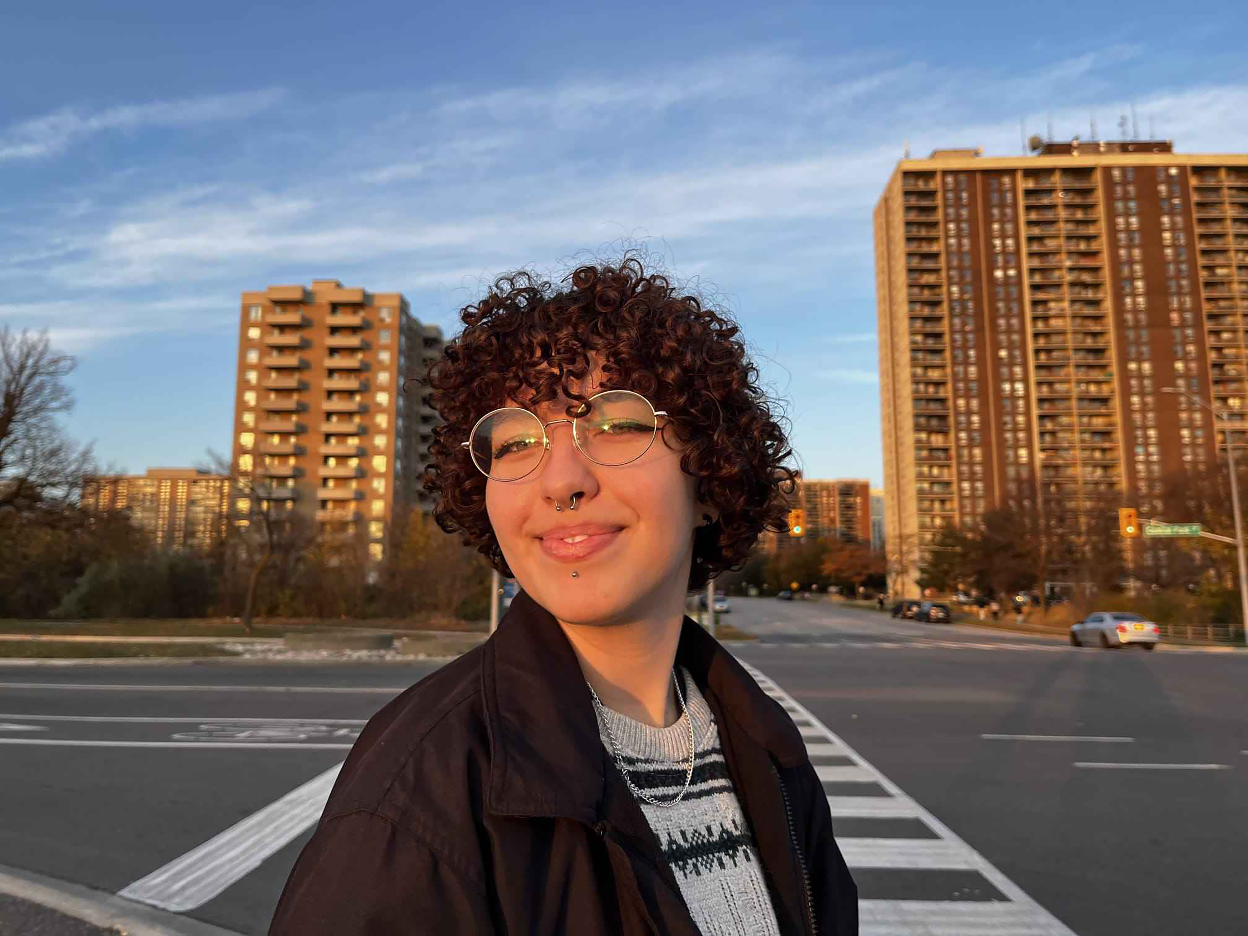 Amber Kopas on a empty street corner at sunset.